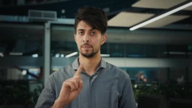 Dissatisfied man arabian ethnic businessman office worker director refuse business offer negatively waving finger NO never gesture deny bad idea disbelief indian male guy reject disapprove not agree