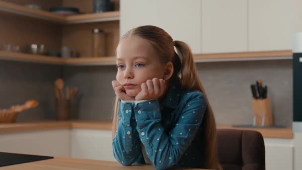 Little Caucasian Sad Upset Child Girl Sitting Home Kitchen Alone – Stock-video