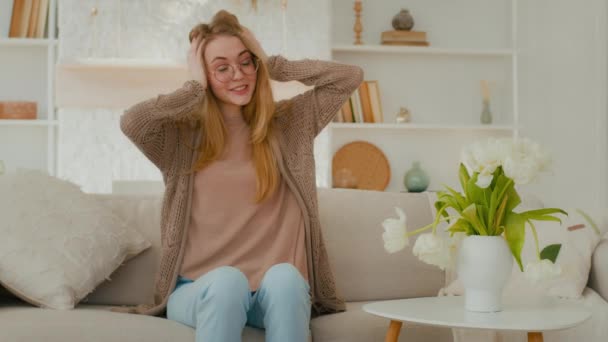 Happy Caucasian Mother Woman Glasses Holding Head Sit Sofa Living — Video