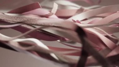 Abstract pink white silk satin leather latex cloth fabric textile ribbons waving on beige background fashion wallpaper business presentation backdrop. Wavy layers tissue fluttering 3D render animation