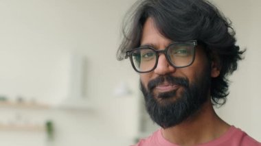 Portrait ethnic multiracial Arabian Indian man in eyeglasses head shot businessman male homeowner in kitchen smiling healthy toothy smile. Adult bearded middle-aged guy in spectacles looking at camera