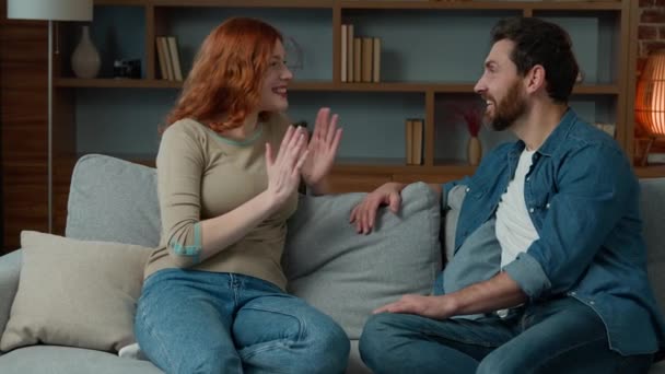 Woman Talking Man Home Joyful Caucasian Couple Sit Couch Redhead — Stockvideo