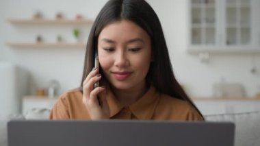Asyalı Çinli iş kadını. Ev bilgisayarından çalışan Koreli kadın. İş görüşmeleri, cep telefonları.
