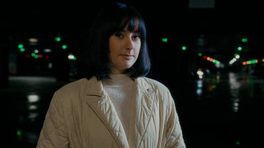 Close up headshot calm portrait Caucasian woman looking away thinking dreaming turn head look at camera female buyer businesswoman girl lady saleswoman automobile car trader driver at parking lot