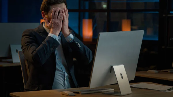 Frustrated stressed businessman work in evening office Caucasian middle-aged man fail lose online project on computer lost business bankruptcy failure lost job desperate anxious male losing problem