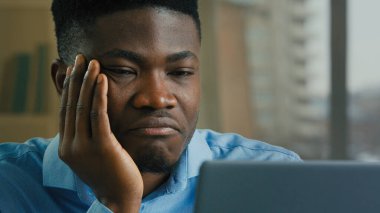 Bored tired exhausted businessman african american man adult sick ill napping office employee work online on computer monotone boring job lack of motivation laziness health problem fatigue need sleep