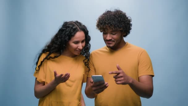 Multiracial Couple Mobile Phone Shopping Online Discuss Woman Man Choosing — Stock Video
