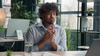 Upset anxious businessman Arabian Indian man working at office write graphics business paperwork no ideas crisis mistake wrong papers difficult work burnout failure crumpling sheet of paper throw away