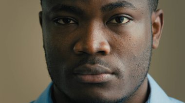 Angry serious man face close up headshot african american 30s businessman worker employee salesman adult ethnic male portrait indoors looking at camera sadness expression loss business health problem