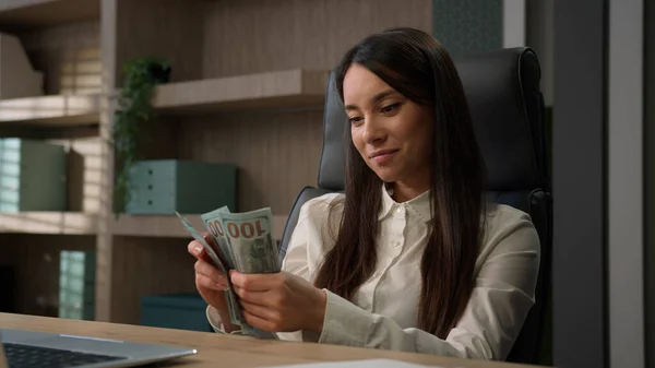 Rich wealthy business woman Caucasian businesswoman financial bookkeeper girl in office entrepreneur counting money cash count salary profit finance jackpot earn investment budget dollars banknotes