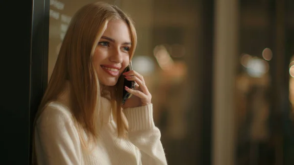 Smiling woman speak phone friendly mobile conversation Caucasian girl 20s businesswoman talking cellphone at office answer cellphone call female business lady listen good news talk smartphone indoors