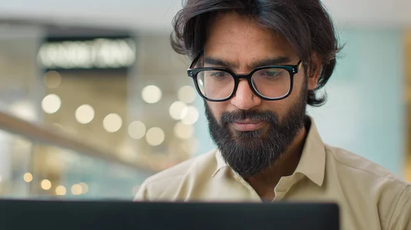 Indian Man Glasses Looking Laptop Screen Working Online Indoors Smiling — Photo