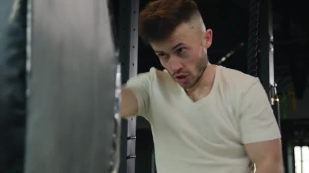 Strong Caucasian Man Powerful Sweaty Guy Fighter Hitting Punching Bag — Stock Video