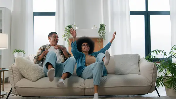 Happy African American Ethnic Couple Jumping Sofa Laugh Having Fun — Stock Photo, Image