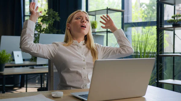 Caucasian frustrated businesswoman lost job computer failure business problem at office upset anxious stressed woman read bad news on laptop rejected bank notification project mistake negative emotion