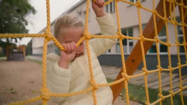 Little Girl Climbing Rope Jacket Autumn City Playground Childhood Physical — Stock Video