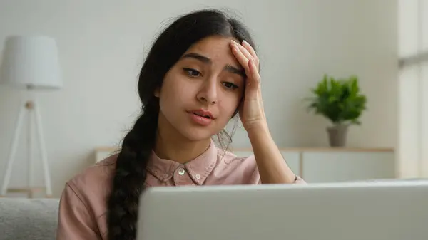 Upset stressful woman Arabian Indian girl businesswoman student fail online exam on laptop negative result disappointed female lady has computer problem at home business failure loss project lose job