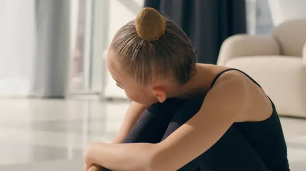 stock image Little girl sad upset stressed offended tired bored Caucasian child kid baby schoolgirl gymnast ballerina dancer negative bad mood adopt daughter custody offense family adopt lonely frustrated at home