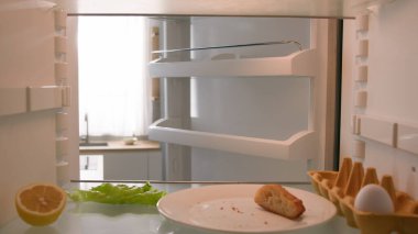 Point of view from inside refrigerator POV Caucasian adult man householder homeowner open fridge door kitchen smell awful smelling guy bad aroma nausea confused odor disgust spoiled food salad leaves clipart