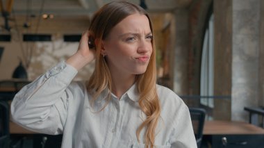 Business financial data work in office confused Caucasian girl analyze diagrams documents businesswoman female business woman scratching head thoughtful solving question problem uncertain hesitation