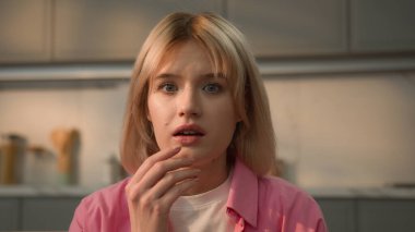 Portrait scared shocked wonder amazed problem surprise insurance credit unbelievable news open mouth shock wondering amazing confused stunned face Caucasian girl woman female at home looking at camera