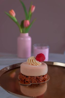 air cake with cream and red berries.