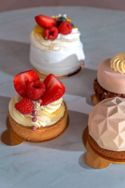 natural cakes with berries, vertical frame.
