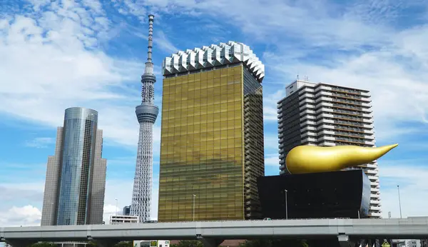 stock image Asahi Beer Hall Buildings and Skytree Tower, Asakusa. Tokyo, Japan.