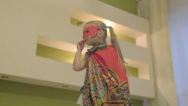 Little Girl Superhero Costume Plays Home Standing Bed Raised Hand — Stock Video
