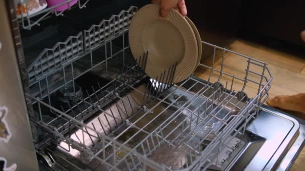 Young Man Putting Dirty Cups Dishwasher Machine Kitchen Household Exhausting — Stock Video