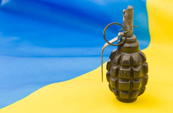 hand grenades on the ukrainian flag