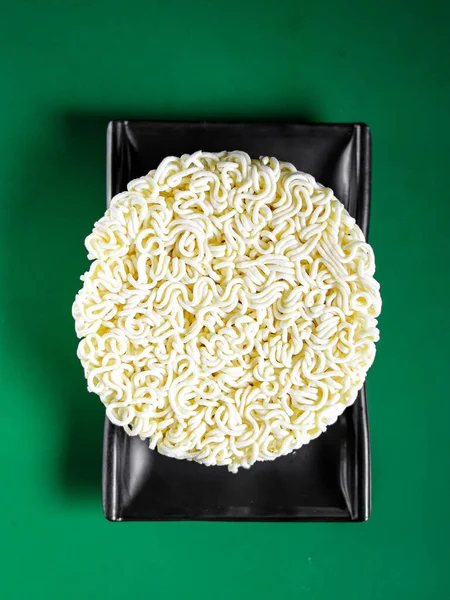 dry and raw ramen noodles. View from above. Chinese cuisine, ingredient for hotpot