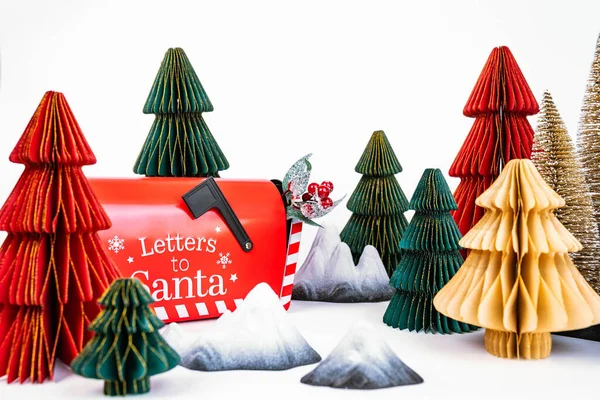 New Years background for a product or card. Colored Christmas trees, Santa Claus mailbox. High quality photo
