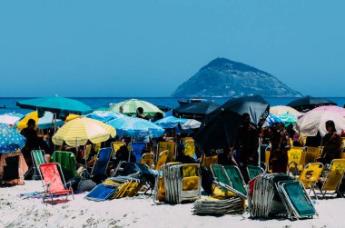 Rio de Janeiro, Brazil - January 15, 2023: Crowd of people at Leme and Copacabana beach on a hot summer day, Rio de Janeiro, Brazil