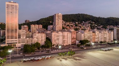 Aerial drone view of Leme neighbourhood in Copacabana with Babilonia favela in the background at sunrise, Rio de Janeiro, Brazil