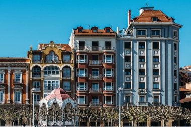 Traditional colourful building in Portugalete, Spain on the banks of the River Nervion clipart