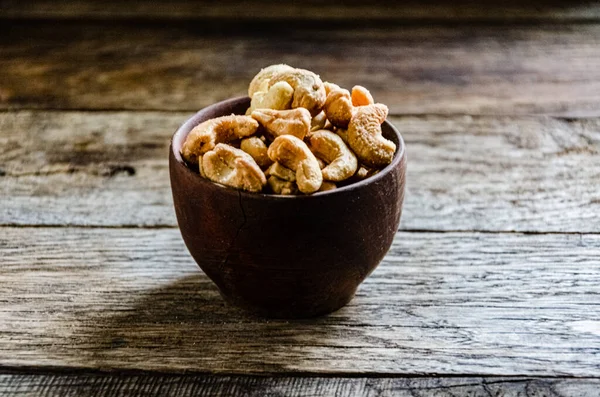Cashew nuts roasted in a ceramic bowl.