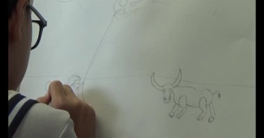 Bufalo çizen çocuk.