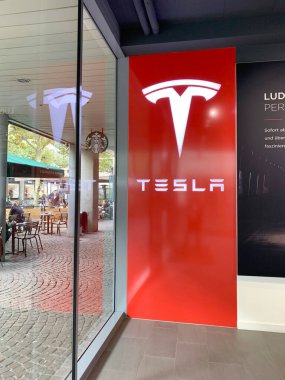 Tesla office, American company, electric car manufacturer Elon Musk, sales center, showroom in Germany, alternative energy development concept, electric vehicle production, Frankfurt - January 2023