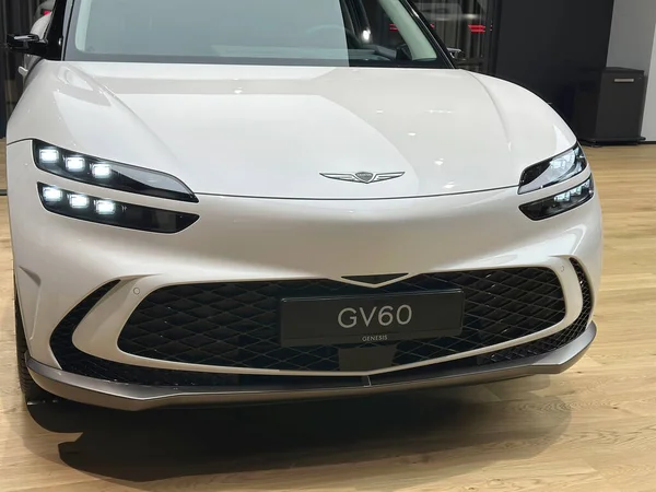white all-electric Hyundai Genesis GV60 car model in Studio Frankfurt, popular korean passenger Electric SUV vehicle in showroom, alternative energy development concept, Frankfurt - January 2023