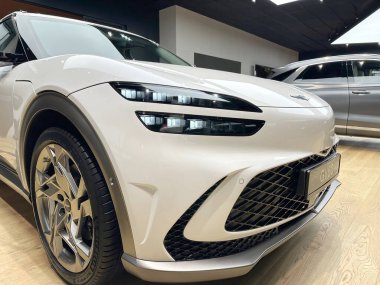 white all-electric Hyundai Genesis GV60 car model in Studio Frankfurt, popular korean passenger Electric SUV vehicle in showroom, alternative energy development concept, Frankfurt - January 2023