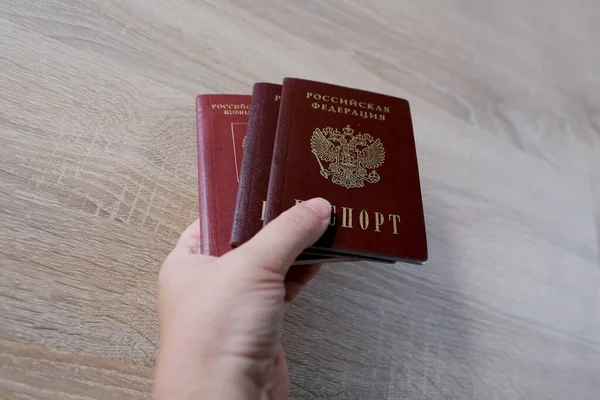 Closeup Female Hand Holding Foreign International Biometric Passports Passport Citizen — Fotografia de Stock