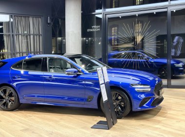 blue Genesis G70 Hyundai car model in Studio Frankfurt, popular korean passenger SUV vehicle in showroom, development concept, Frankfurt - January 2023