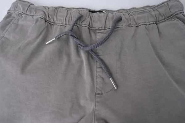 Zblízka Textura Šedých Bavlněných Kalhot Kalhoty Kapsami Pouta Kotníky Stahovací — Stock fotografie