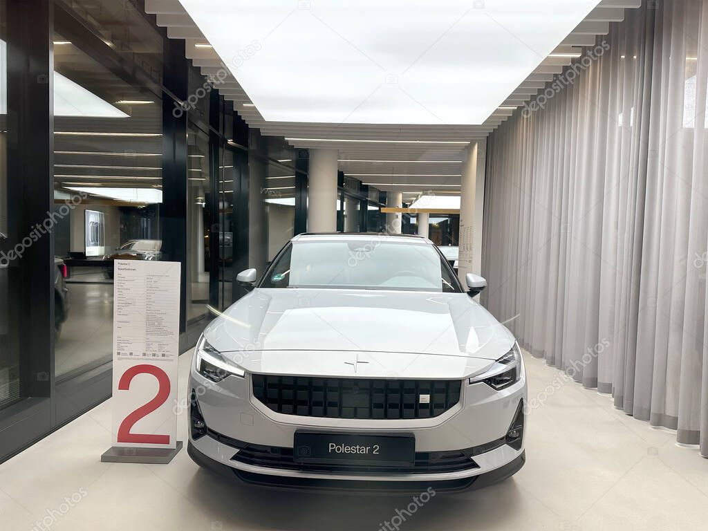 White all-electric Polestar 2 car model in Studio Frankfurt, part of Volvos EV subsidiary, Dual-motor examples, alternative energy development concept, Germany, Frankfurt - January 2023