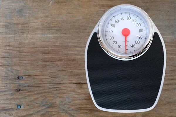 stock image floor mechanical scales in vintage style, scale with red arrow in circle in circle, top view, the concept of weight control, human physical health, diet and nutrition, lose weight