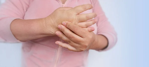 stock image closeup female hands 55 years old with dry skin damage, applying moisturizer, concept care aging skin, treatment dermatological diseases, hydration and nutrition of epidermis, age-related skin changes