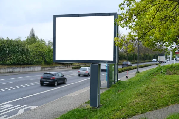 empty display on busy street, cars passing by, horizontal banner outdoor advertising in city, electronic empty blank white screen for designer, busy road traffic, crossroads in Germany, Frankfurt