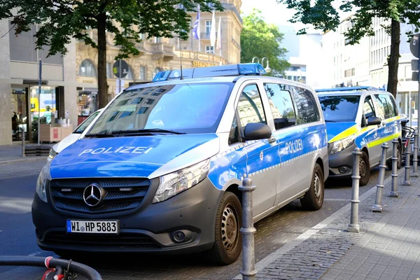 stock image police cars on streets of germany, law enforcement officers guarding order on vehicles, patrolling, sending law enforcement officers to incident or crime, investigating crimes, Frankfurt - August 2022