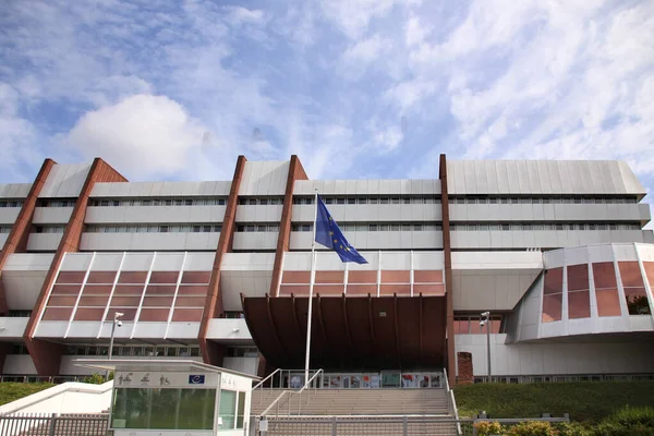 stock image Strasbourg, France 7, August 2021: flag of Europische Union in front of building of international organization Council of Europe, concept of standards of law, human rights and cultural interaction 